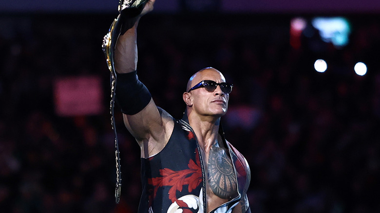 Dwayne "The Rock" Johnson is introduced during a tag team match with Roman Reigns against Cody Rhodes and Seth "Freakin" Rollins during Night One of WrestleMania 40 at Lincoln Financial Field on April 06, 2024 in Philadelphia, Pennsylvania.