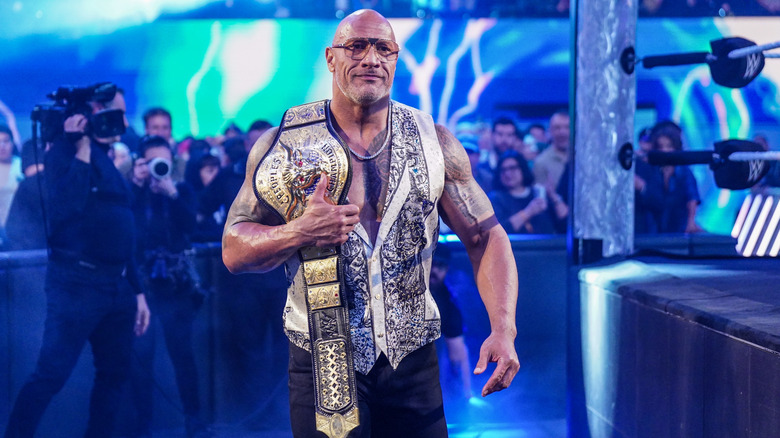 The Rock, with The People's Championship in hand, heads to the ring