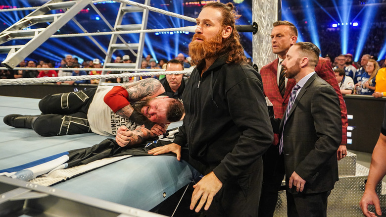 Zayn and Owens at ringside at WWE Royal Rumble