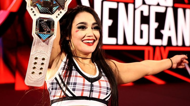 Roxanne Perez holds the NXT Women's Championship high