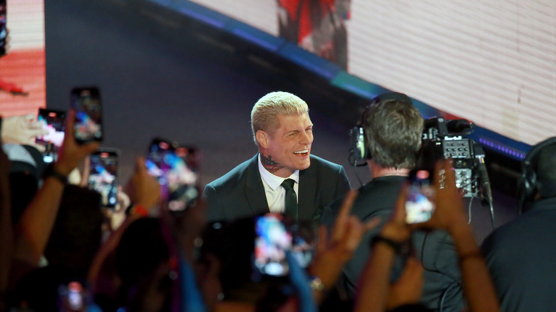 Cody Rhodes during his entrance at a WWE event