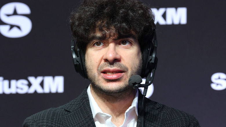 Tony Khan wearing a headset