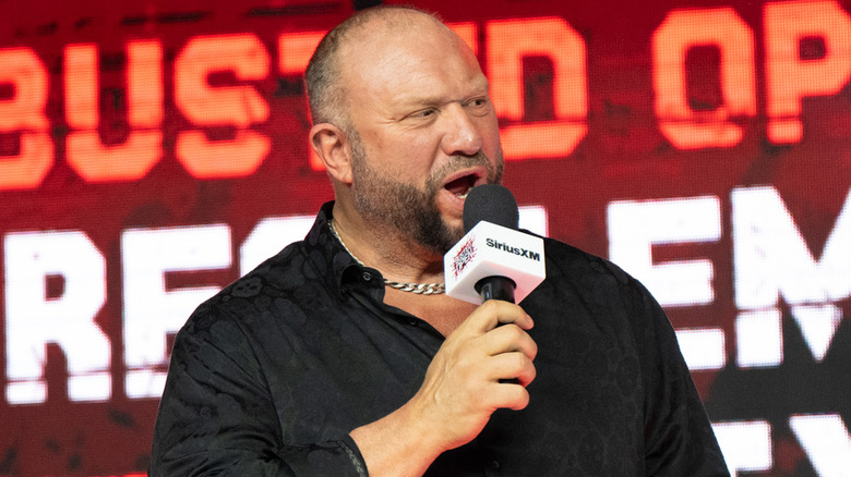 Bully Ray speaking into a handheld microphone