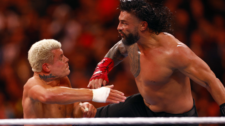 Roman Reigns delivers a Superman Punch