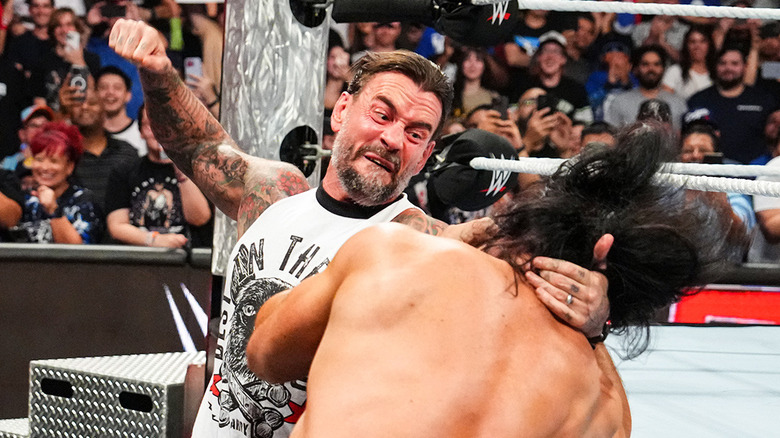 CM Punk punching Drew McIntyre