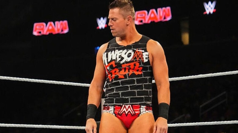 The Miz stares down at former tag team partner R-Truth after turning heel on him during a match, as Karrion Kross looks on from the outside, on an episode of "WWE Raw."