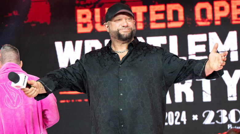 Bully Ray on stage holding a mic