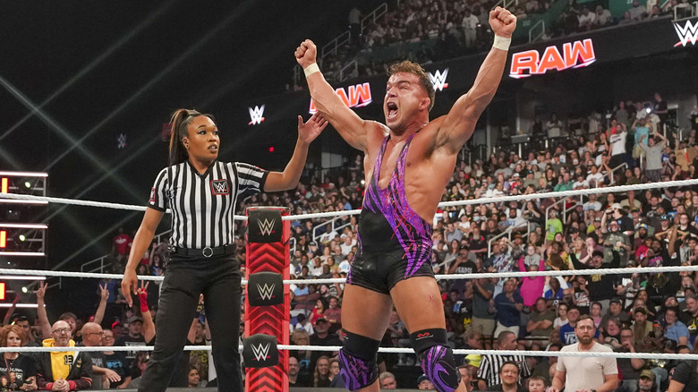 Chad Gable getting his hand raised by WWE referee Aja Smith