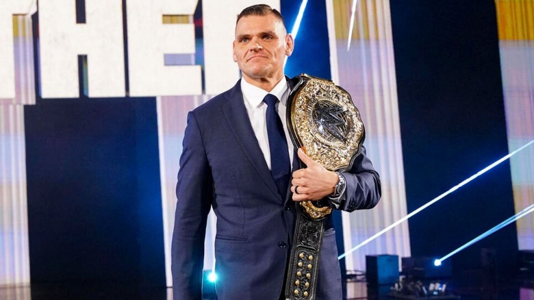 GUNTHER heads down the ramp to the ring with his World Heavyweight Championship over his shoulder.