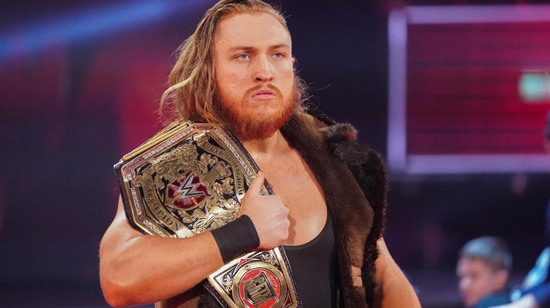 Pete Dunne holding NXT UK Championship