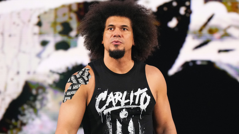 Carlito wearing a black tank top