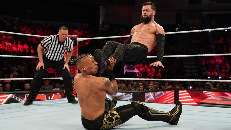 Carmelo Hayes gets kicked in the face by Finn Balor