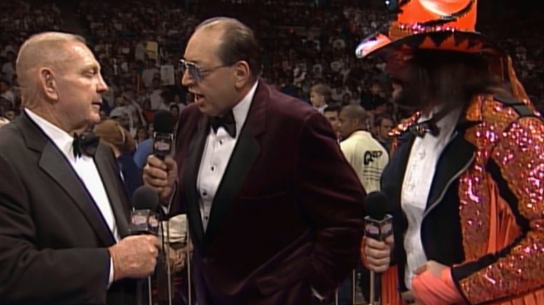 Art Donovan stands by Gorilla Monsoon and Randy Savage