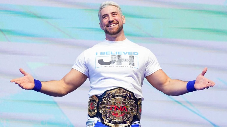 Joe Hendry smiles on at the top of a TNA ramp a week after capturing the TNA World Championship