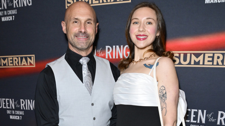 Christopher Daniels smiling alongside his daughter