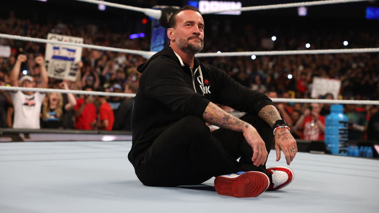 CM Punk sitting in the ring