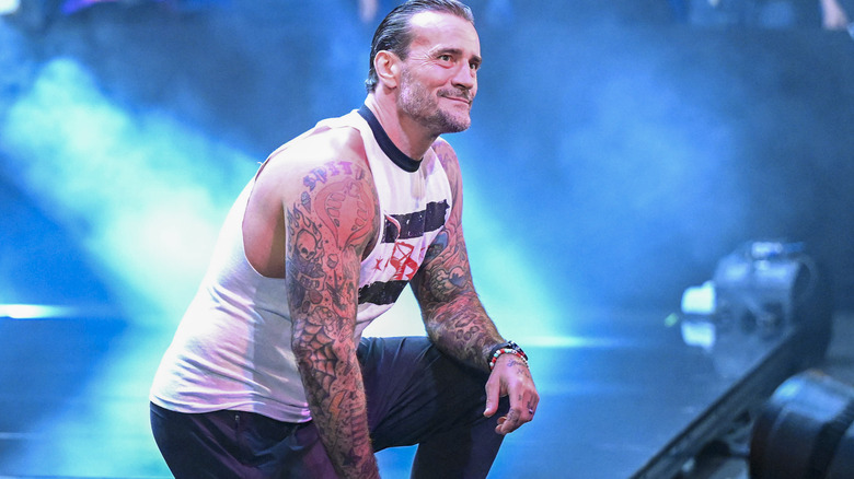 CM Punk kneeling