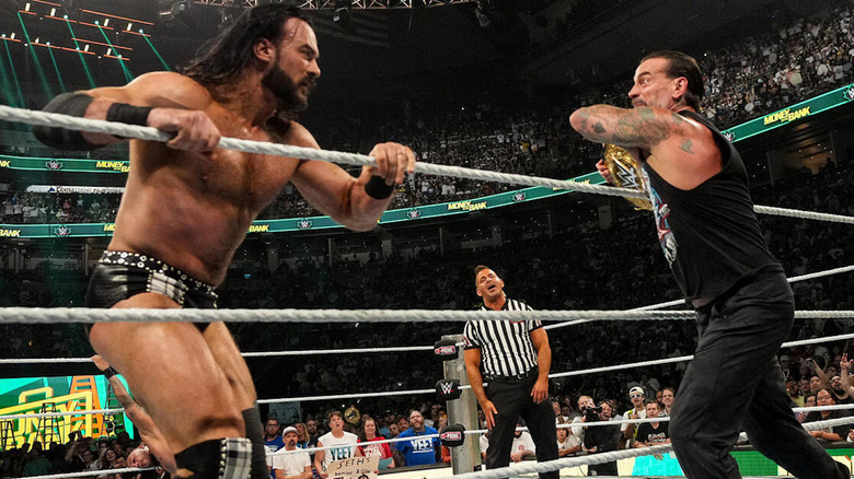 CM Punk attacking Drew McIntyre