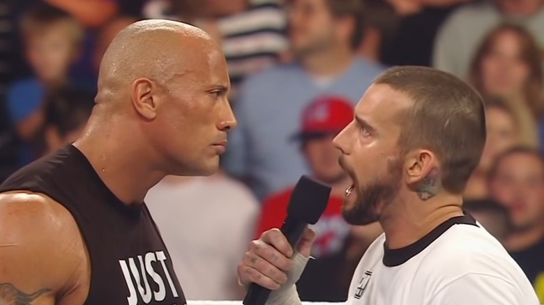 CM Punk speaking to The Rock