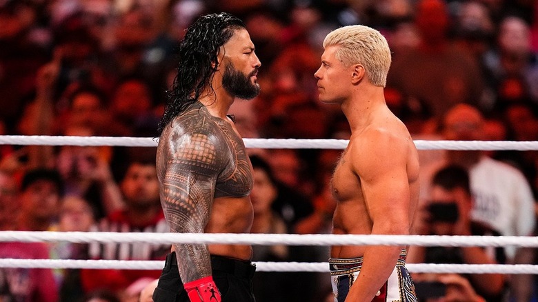 Cody Rhodes and Roman Reigns stare down