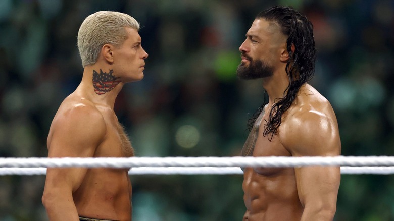 Cody Rhodes and Roman Reigns stare down