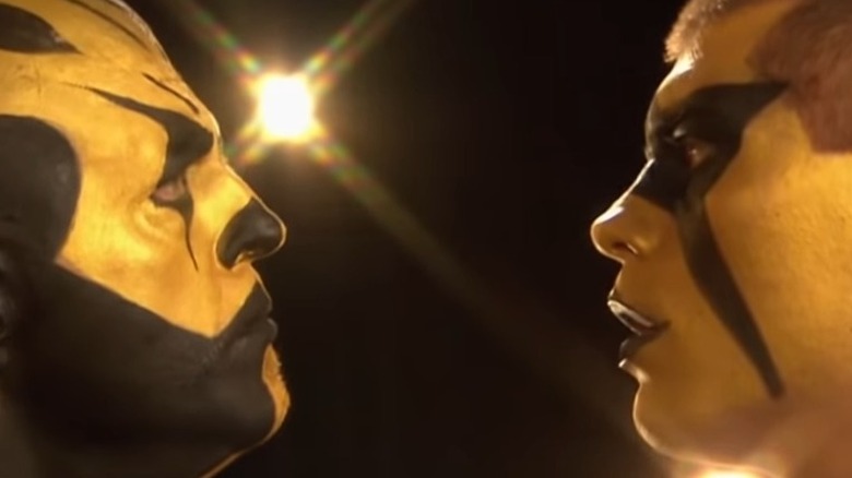 Stardust and Goldust stare at each other