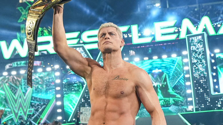 Cody Rhodes holding up WWE Championship 