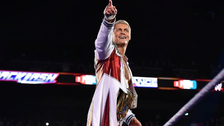 Cody Rhodes stands on the turnbuckle with the Undisputed WWE Championship around his waist before his match against AJ Styles at Backlash in Lyon, France.