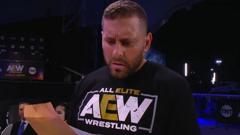 Colt Cabana looking at documents