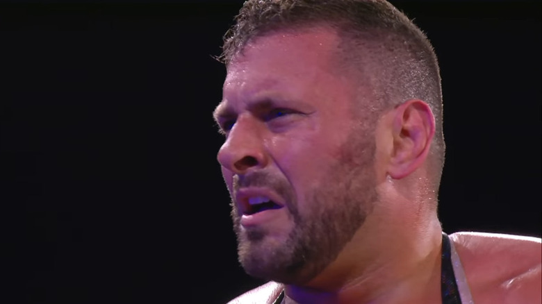 Colt Cabana looking confused on the ring apron