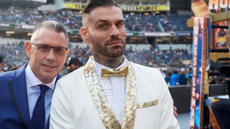 Michael Cole and Corey Graves, during happier times