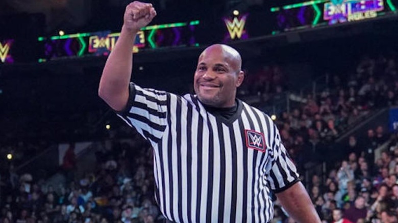 Daniel Cormier raises fist inside WWE ring