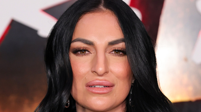 Sonya Deville posing on red carpet