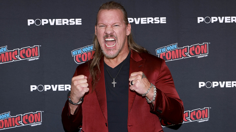 Chris Jericho makes fists and shouts