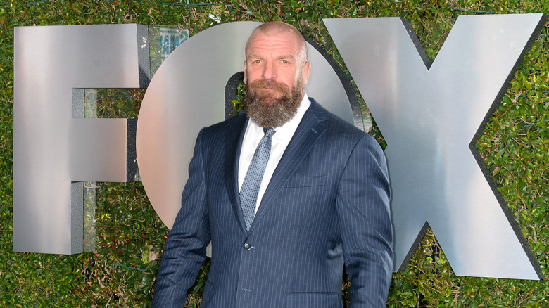 Triple H in front of FOX logo