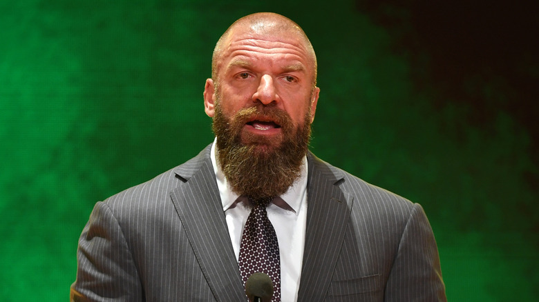 Triple H standing at microphone for crown jewel 