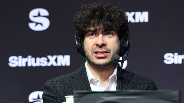 AEW President Tony Khan looking upset