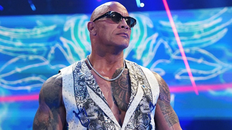 The Rock making his way to the ring during a WWE show, 2024