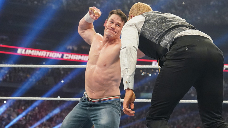 John Cena punching Cody Rhodes with a Rolex watch at WWE Elimination Chamber