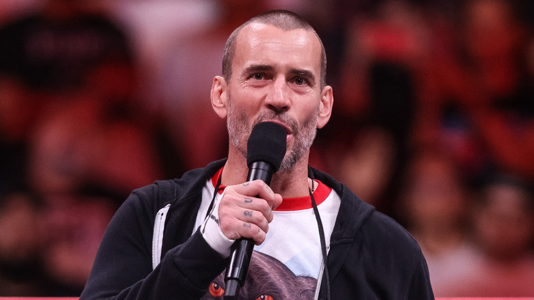 CM Punk speaking with a microphone