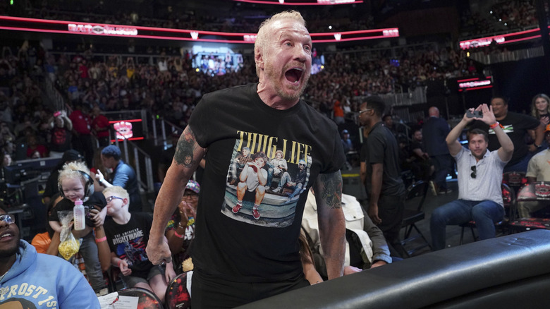 DDP posing in the crowd at a WWE event