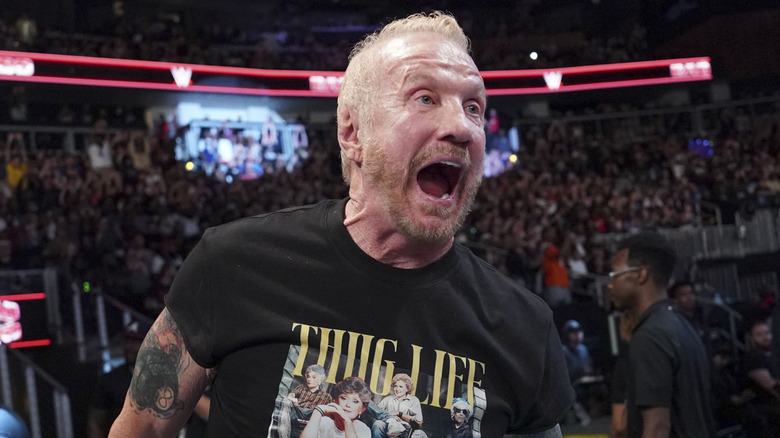 DDP celebrates with the crowd during an appearance at "WWE Raw"