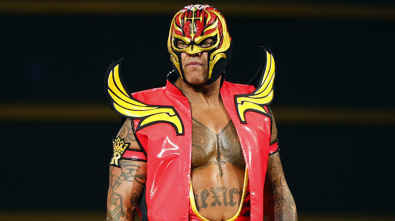 Rey Mysterio wearing red and yellow ring gear