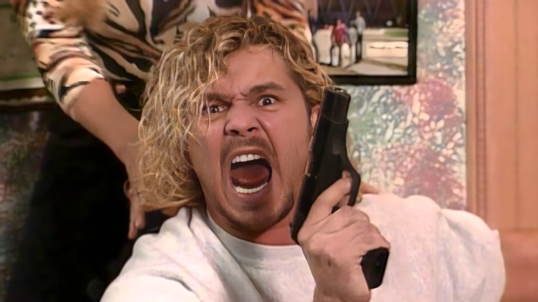 Brian Pillman holding a gun