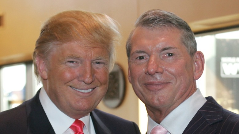 Donald Trump poses for a photo with Vince McMahon