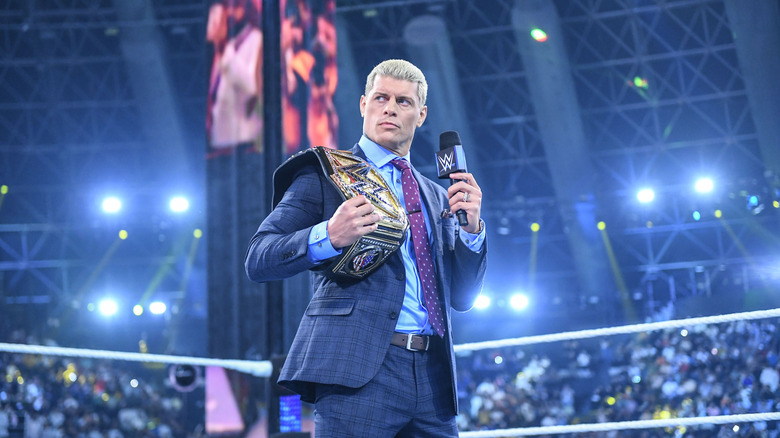 Cody Rhodes holding a mic