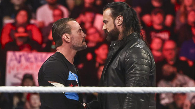 CM Punk and Drew McIntyre staring at each other