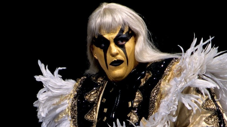 Goldust in a wig and extravagant costume