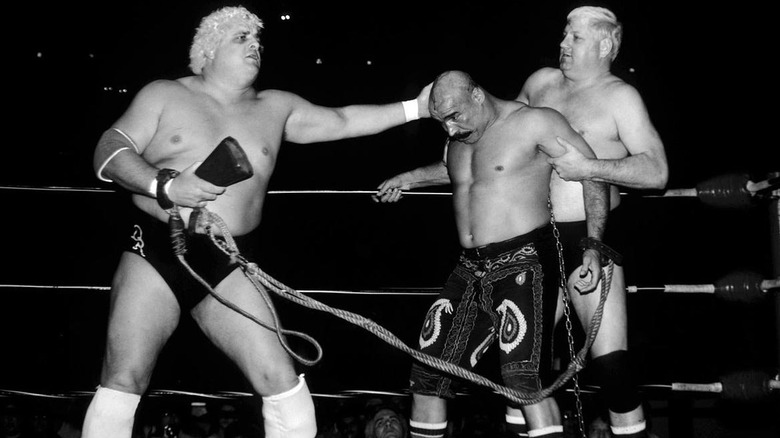 Dusty Rhodes and Dick Murdoch attacking The Iron Sheik