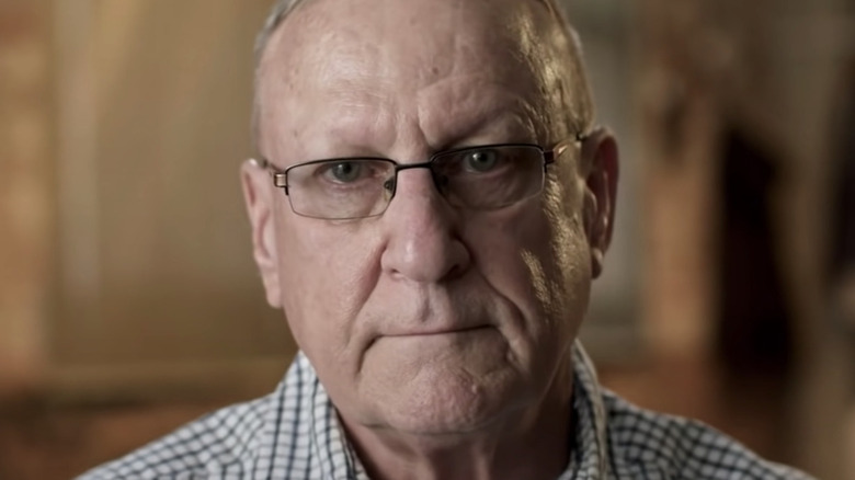 Earl Hebner focused face in glasses